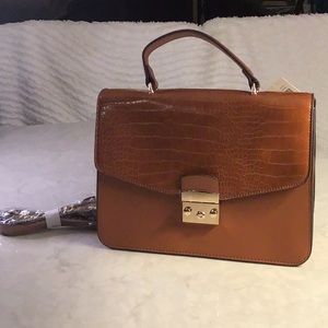 IMAN Satchel type handbag that can convert to crossbody. NEW, NEVER USED